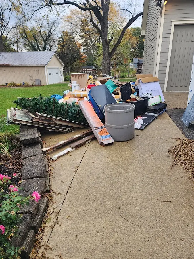 Dumpster being loaded with debris for Demolition Dumpster Rental in Miamisburg